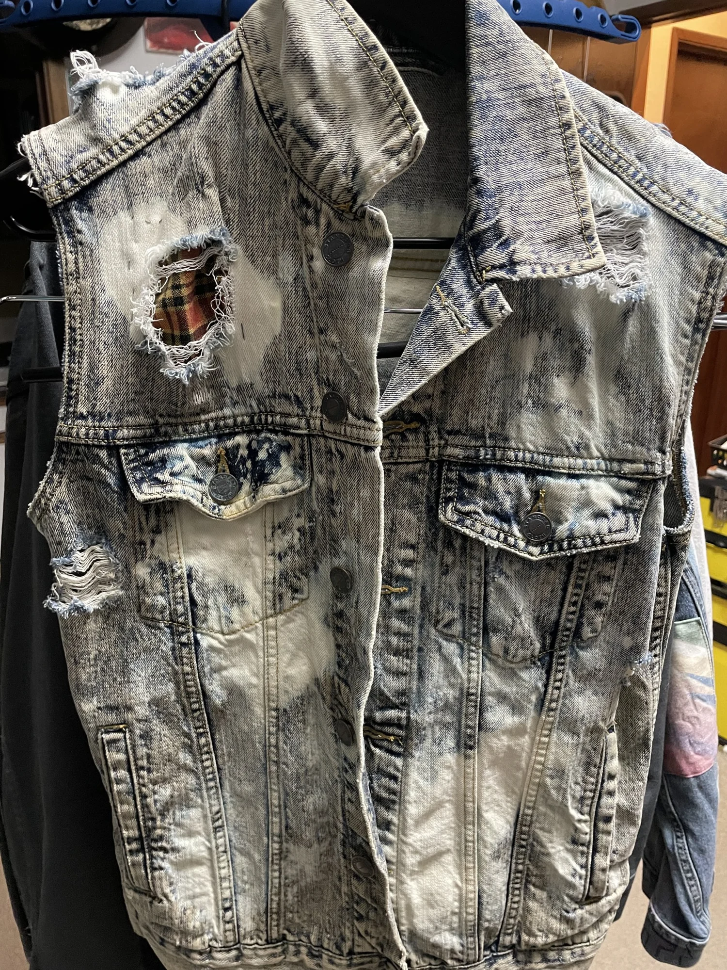 Distressed portrait vest / front